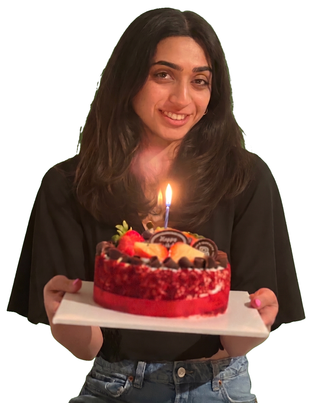 Shailee holding a birthday cake with a candle